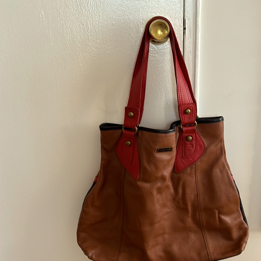 Leather brown trapezoid shape bag with black & red trim and red handles